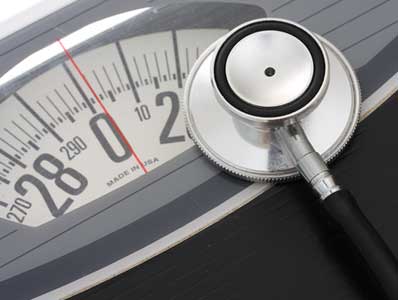 Weight loss - stethoscope on a scale